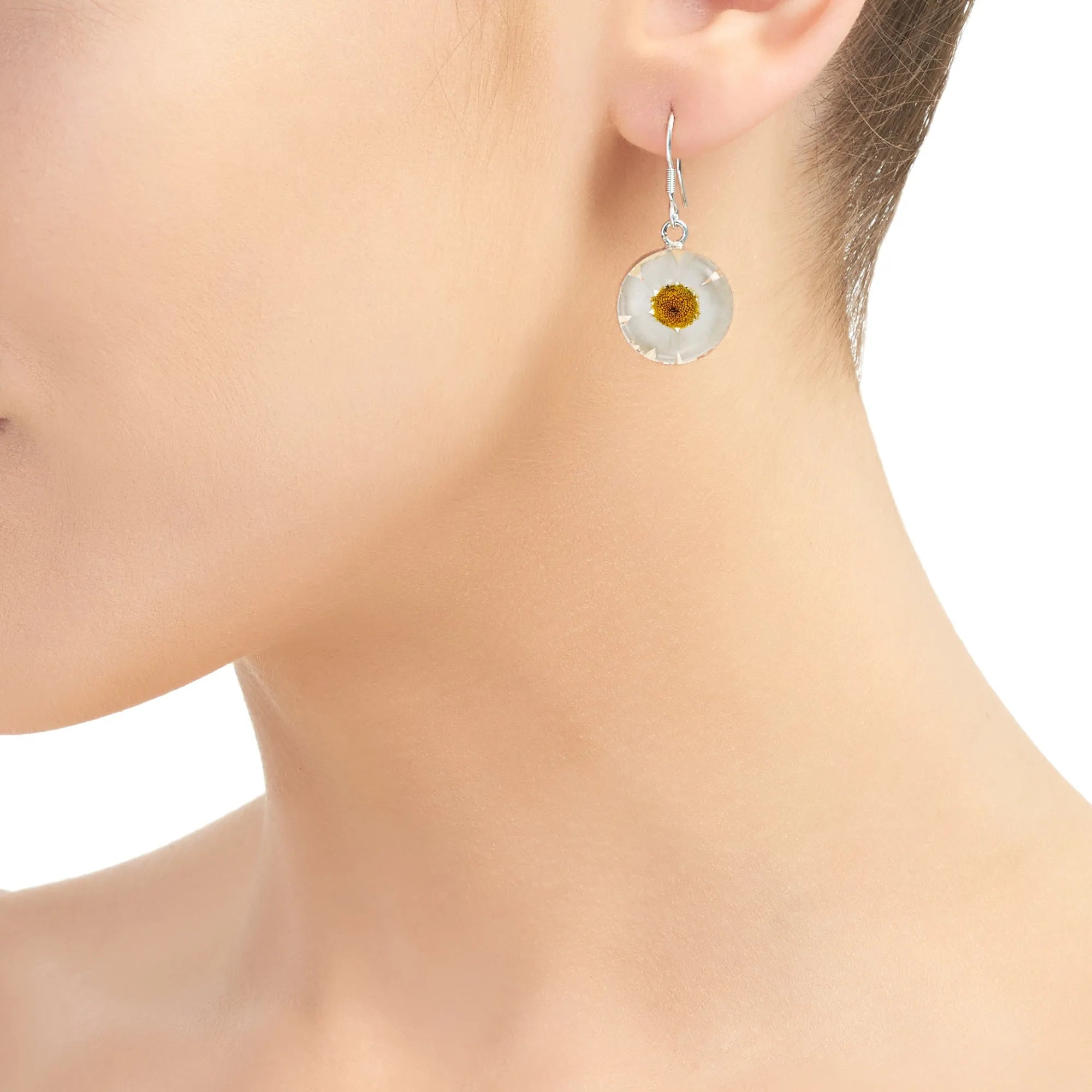 Daisy necklace by Shrieking Violet® Sterling silver & real daisy in a round pendant.